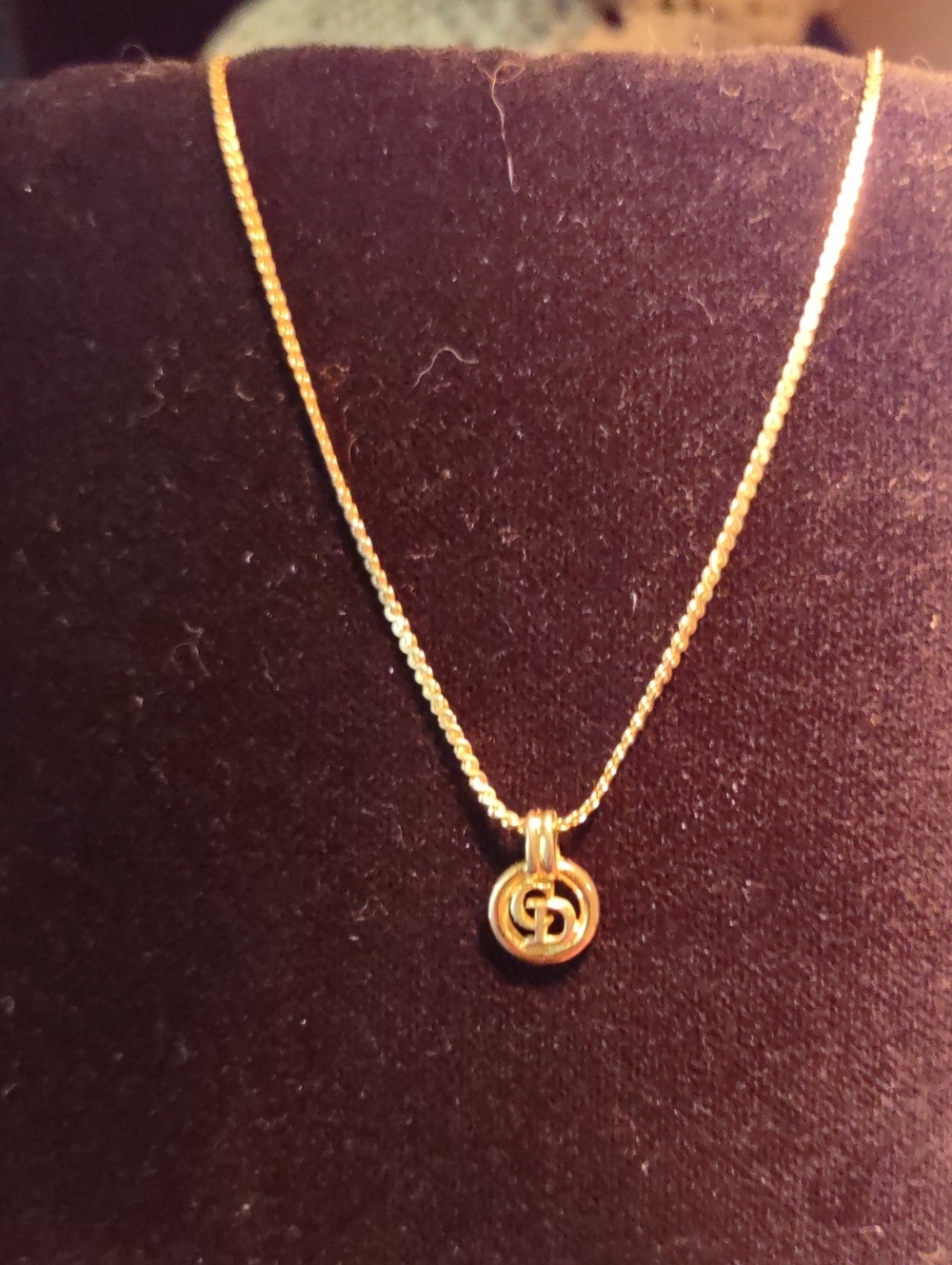 Christian Dior Gold Interlocking CD Pendant Necklace.